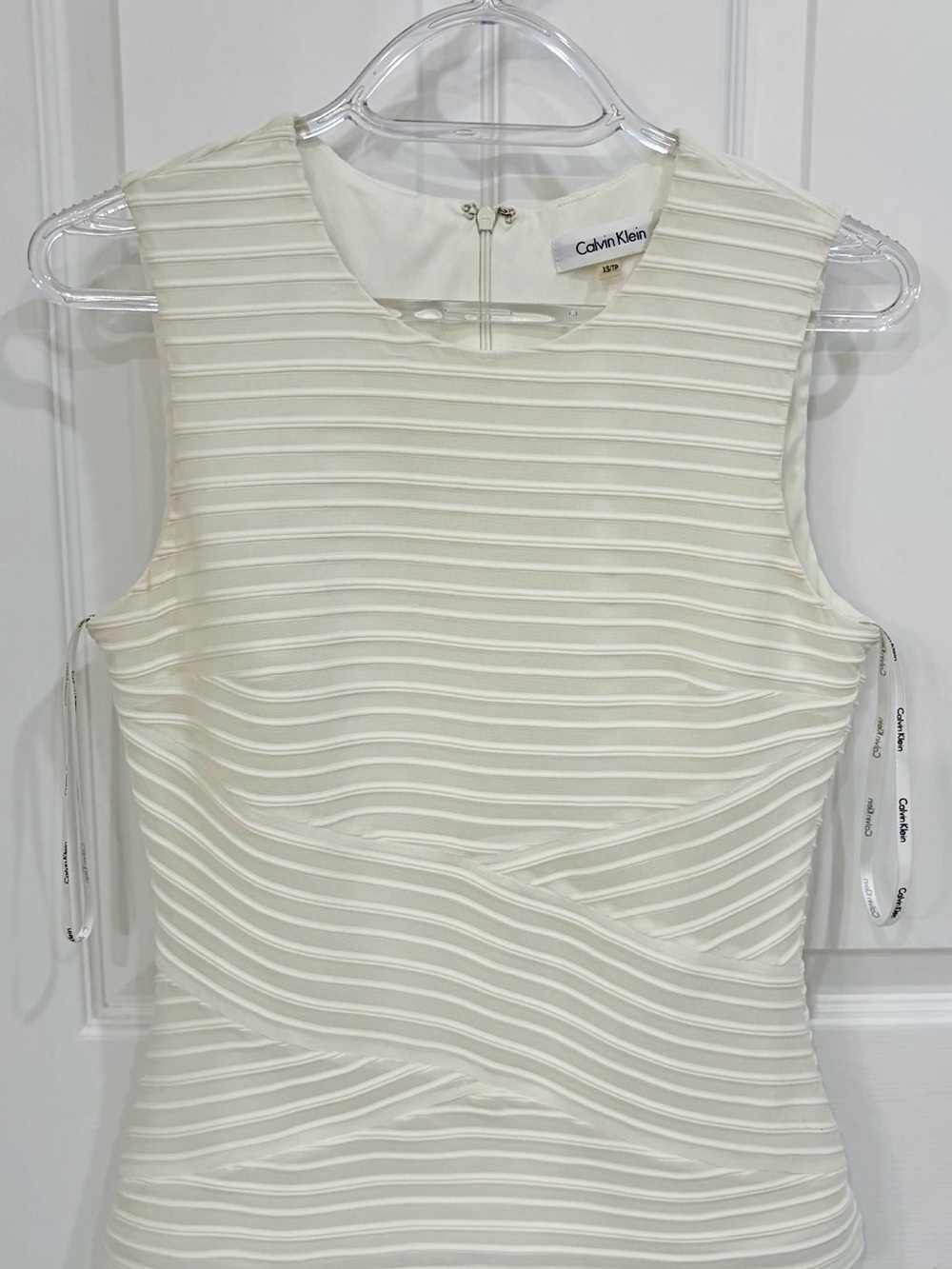 Calvin Klein off-white textured  shear Sleeveless Top with camisole underlay.